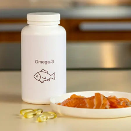 Omega-3 supplement bottle with fish icon, salmon slices, and softgel capsules on table