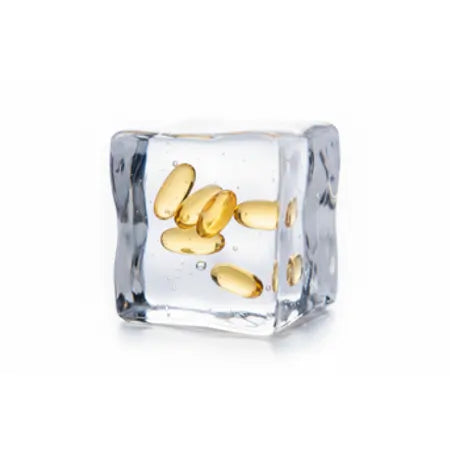 Omega-3 supplement capsules frozen inside a clear ice cube, white background