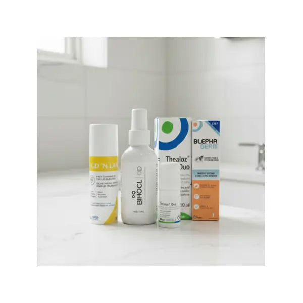 Eye care products for dry eyes, blepharitis, and redness relief on a bathroom counter