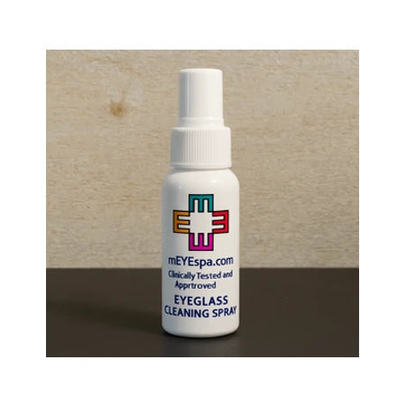 Eyeglass cleaning spray bottle on a table, with colorful medical logo and clear label text.